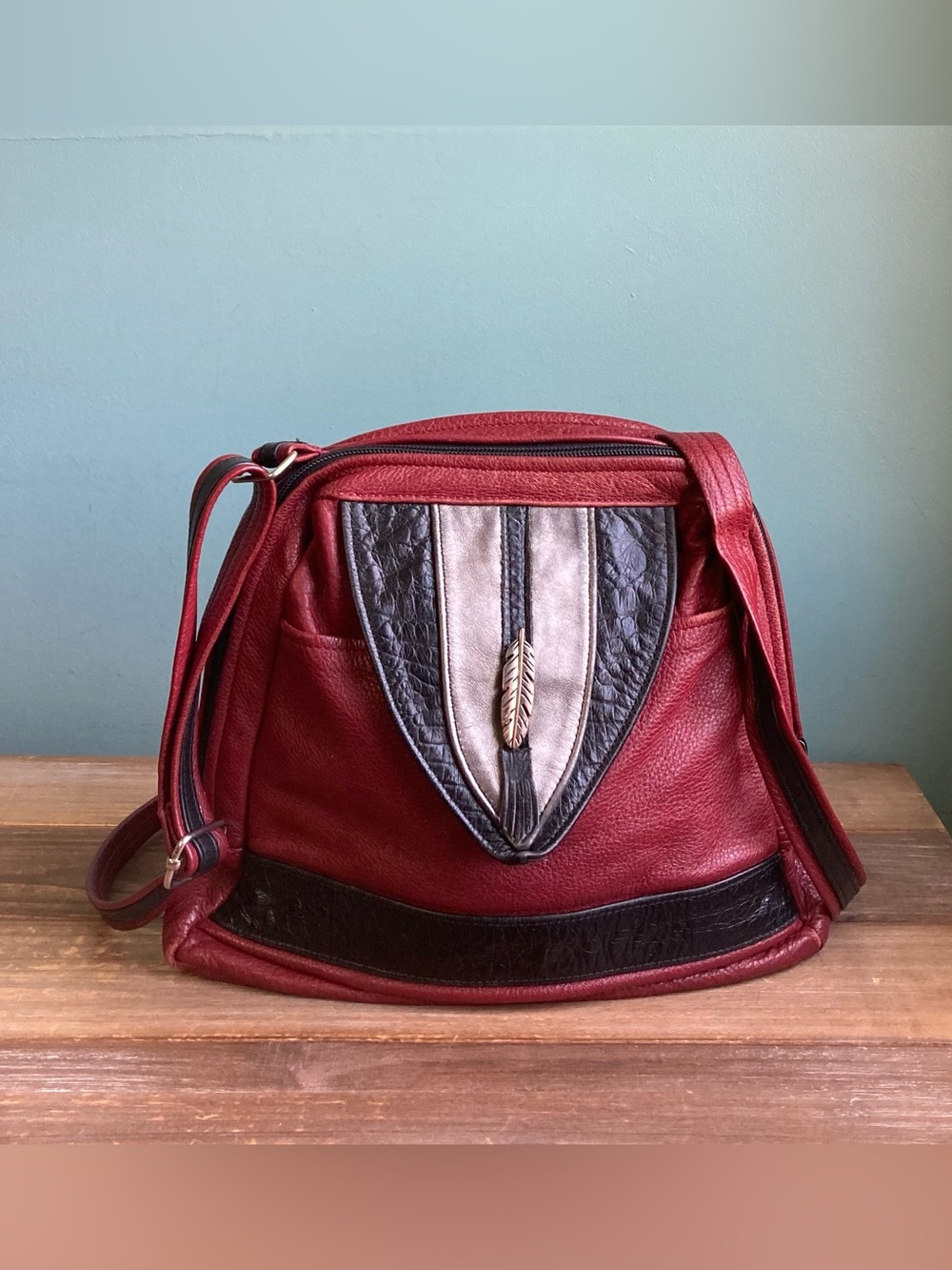 Women's Red Leather Crossbody Bag with Decorative Feather Accent